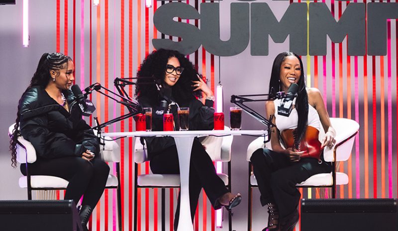 Three women podcasting at the Summit.